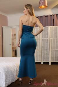 Anabel gets creative and makes an artistic poses wearing her blue evening dress and heels
