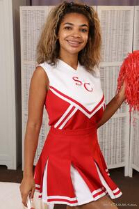 Cute ebony girl Jay flaunts her slender body clothed in cheerleader uniform