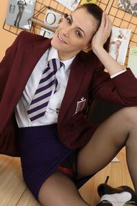 Magnificent little brunette Becky X posing in college uniform and ankle socks.