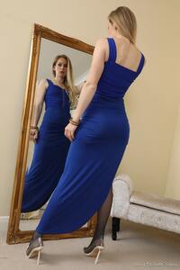 Stunning Anabel shows off her round bottom and takes off her blue evening dress and stockings