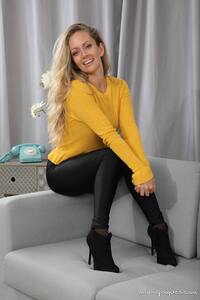 Suzi showcases her svelte legs wearing tight pants with black stockings and her body's surprising poses
