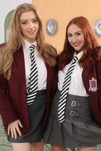 The stunning Jen Loveheart and Rachelle smiles sweetly in their matching college uniform
