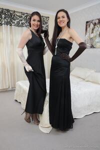 Two amazing brunettes rocks the modeling world as they hits the set in evening gowns.