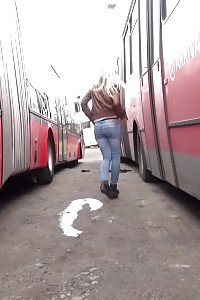 Erotic Blonde Slut Pisses Between Parked Buses