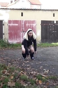 Blonde Princess Pissing Next To Some Garages