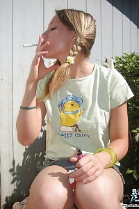 Next Door Kitty Burning A Cigarette And Displays Her Panties