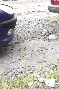 Black Haired Slut Pisses Behind A Parked Vehicle
