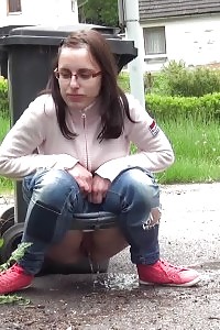 Black-haired In Glasses Pissing Onto Her Trainers