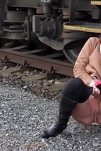 Cynthia Vellons Pisses Next To A Railway Line